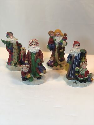 #ad set of four Santa figurines $12.99
