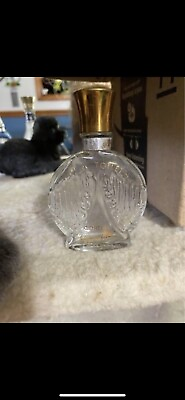 Vintage glass perfume bottle with wing design. $10.00