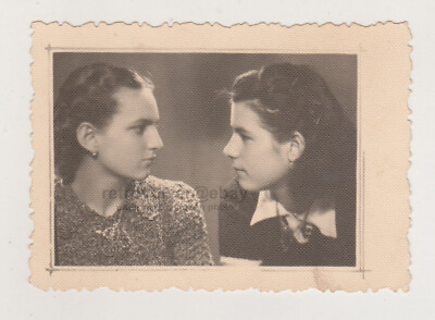 #ad Two Beautiful Young Women Lock Eyes Sharing Emotions Gaze of Connection Photo $9.99