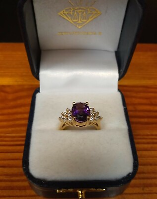 #ad 2.50Ct. Vibrant Oval Amethyst Flanked by a .50Ct. of Diamonds In 14K Yellow Gold $500.00