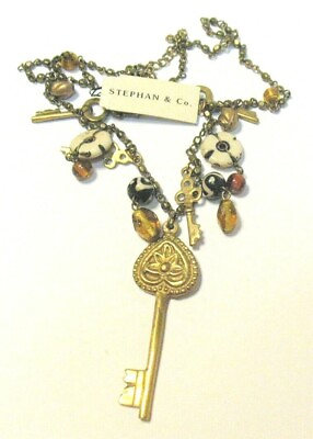 #ad STEPHEN amp; CO CHARM NECKLACE GLASS BEADS KEYS DISCS GOLD TONED 22 INCHES $125.00